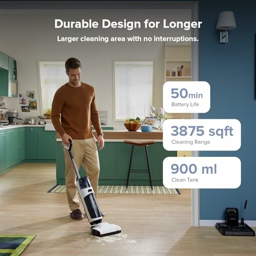 Man using cordless vacuum cleaner on kitchen floor