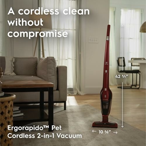 Cordless vacuum cleaner in a living room setting.
