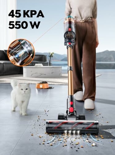 Cordless vacuum cleaner in use near a cat, cleaning debris on the floor.