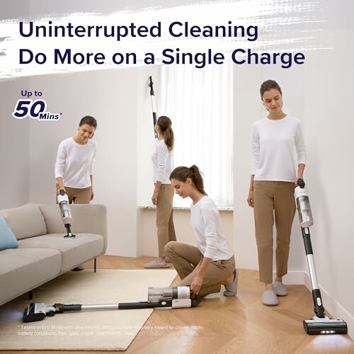 Woman using a cordless vacuum cleaner in a living room.