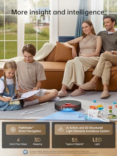 Family sitting on floor with robot vacuum and toys.