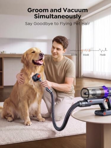 Man using vacuum to groom a golden retriever.