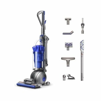 Upright vacuum cleaner with assorted attachments.