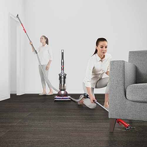 Person using a vacuum cleaner for home cleaning
