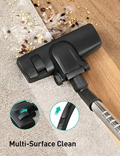 Vacuum cleaner head on carpet with debris.