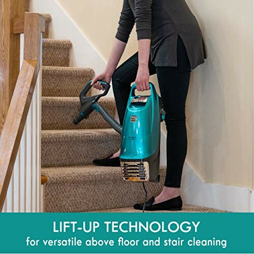 Person using a vacuum cleaner on stairs with lift-up technology.